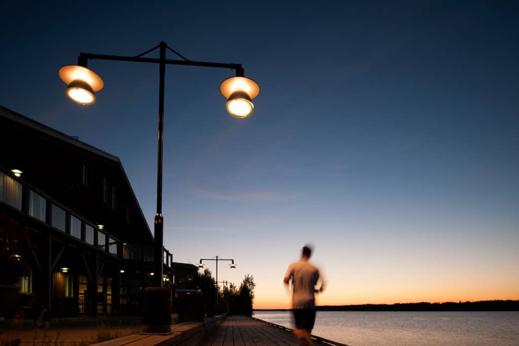 Man jogging on waterfront, Lulea, Sweden